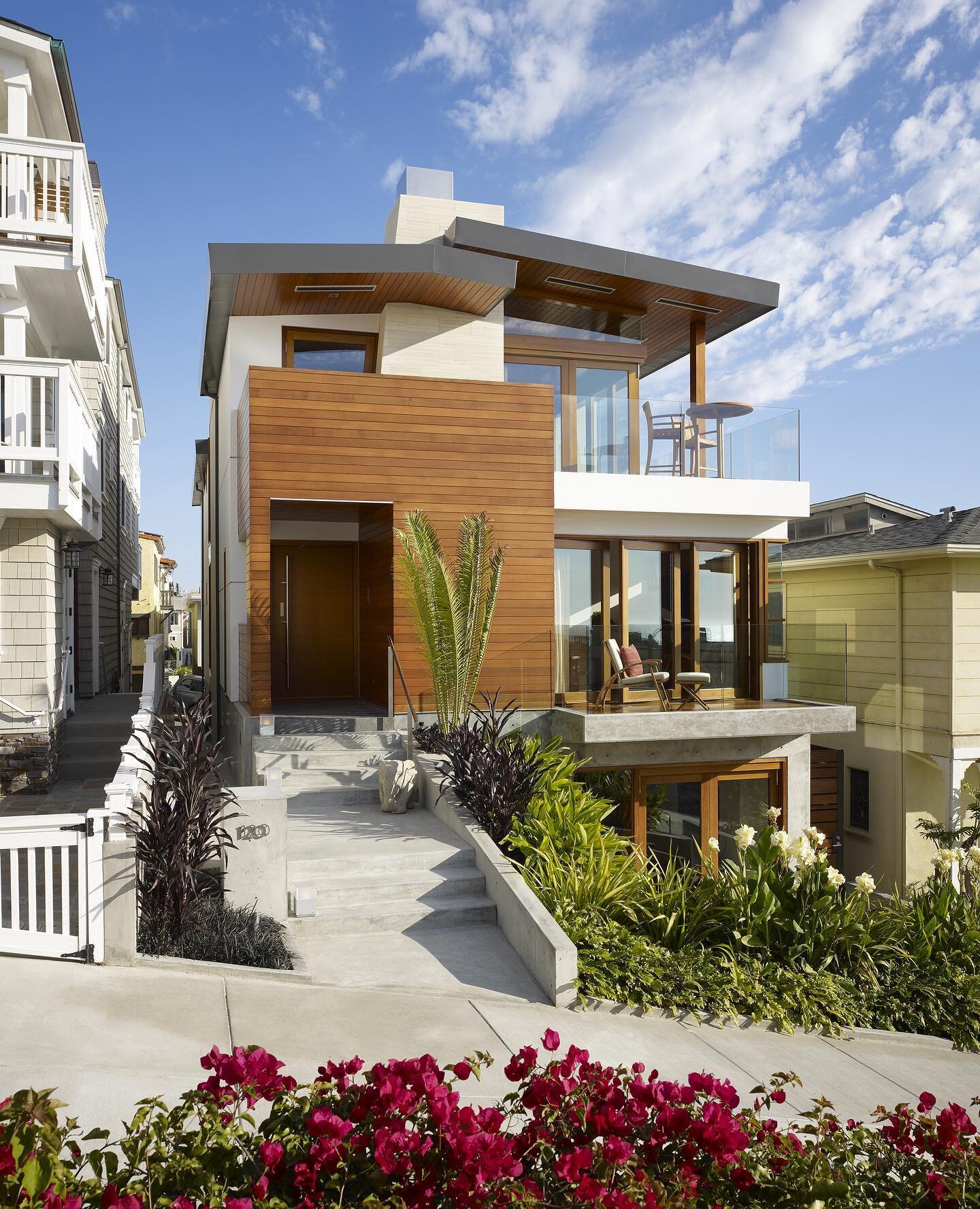 In the Sand Section of Manhattan Beach the design of a home is a delicate balance between privacy and views. Careful thought was put into where each window and opening was placed on this beach home. Along the tight side yards of property the house is