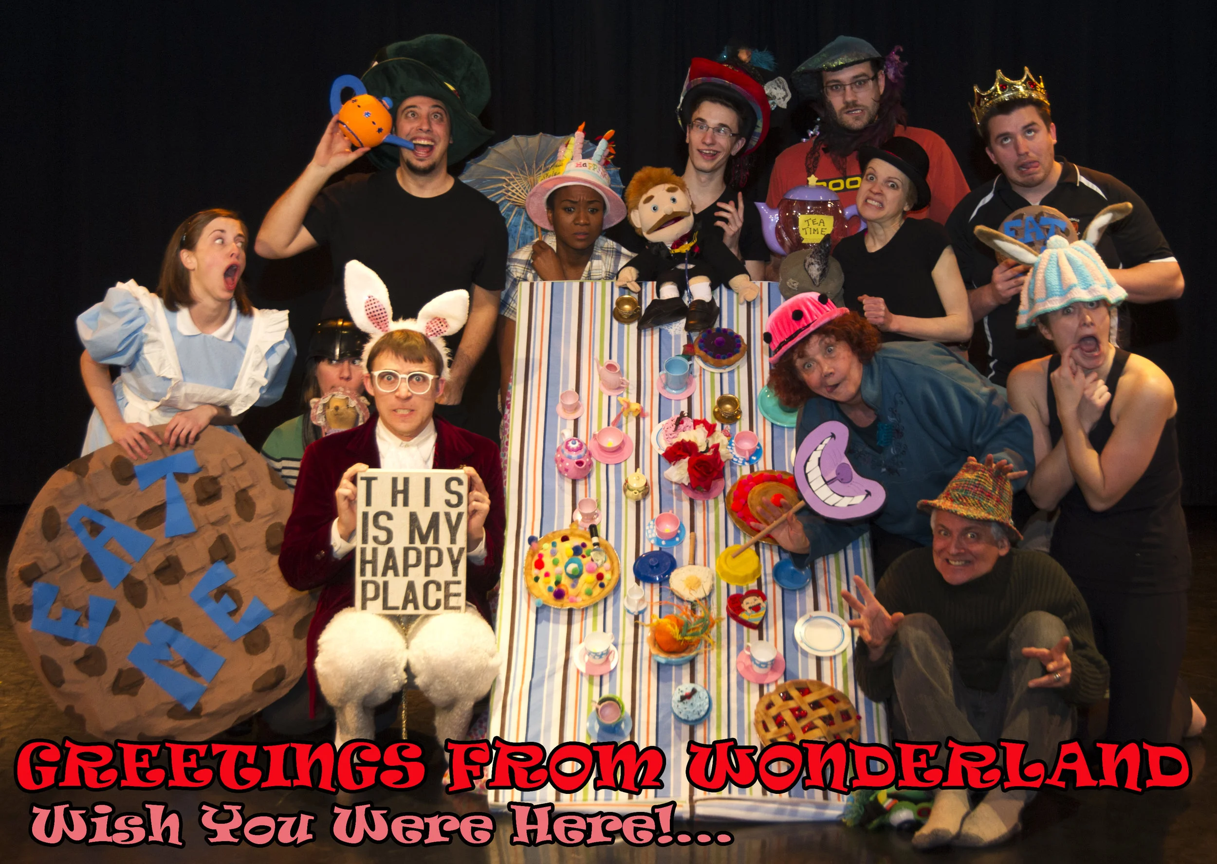 Left to Right (ish): Lindsay Sippel Eitzen (Giant Cookie), Darcey Giffin (Darth Vader Helmet), Chris George (Happy Place), Mark Palumbo (Teapot), Natalie Morgan (Birthday Cake Hat), Adrian Eitzen (Doctor Puppet), Andre Morin (Sequin Hat), Carolyn Lawrence (Bowler Hat), Luke Bramer (Crown), Lynne Griffin (Cheshire Cat Smile), Katie Leamen (Tea Cosy with Ears), Sean Sullivan (Plaid Fedora, but what's with the creepy hards?)