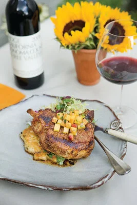 Grilled Ancho Chili Rubbed Pork Chops with Peach Chutney and Arapaho Cakes