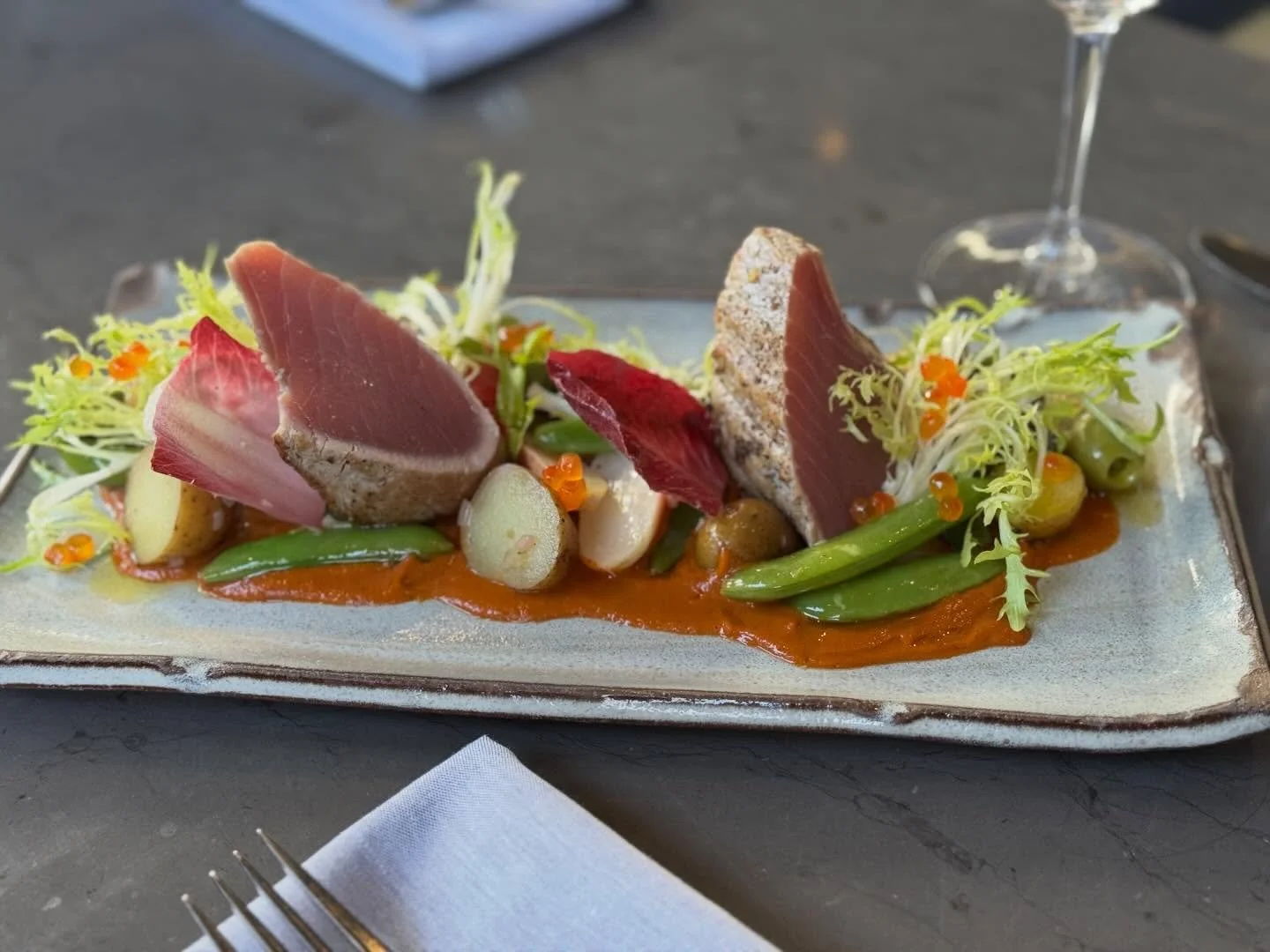 Hello Spring!
Fresh catch of the season: Ahi Yellowfin Tuna, Snap Peas, Fresh Dug Potatoes, Olives, Salmon Roe, Roasted Tomato Vinaigrette, Fris&eacute;e and Anchovy Dressing.

#hotandhotfishclub #springmenu #tuna #nicoisesalad #alseafood