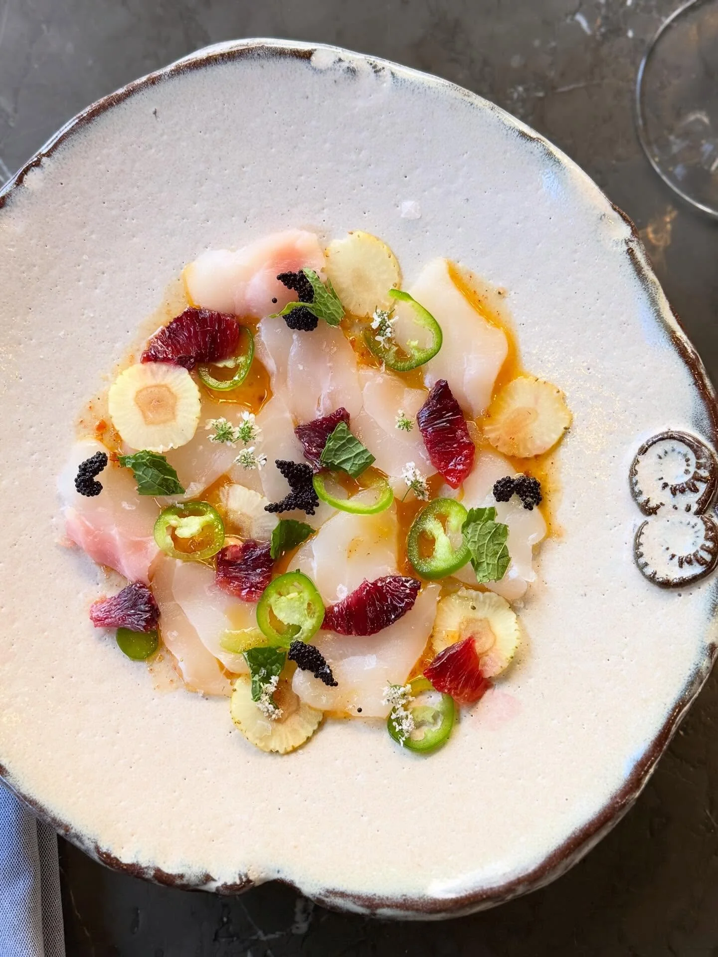 Yellowedge Grouper Crudo
Lemon, green strawberries, yuzu kosho vinaigrette, and caviar

Clean, bright, and just enough heat. Citrus and sea, layered with a little texture and pop in every bite.

#hotandhotfishclub #crudo  #bhamfoodie #freshcatch #als