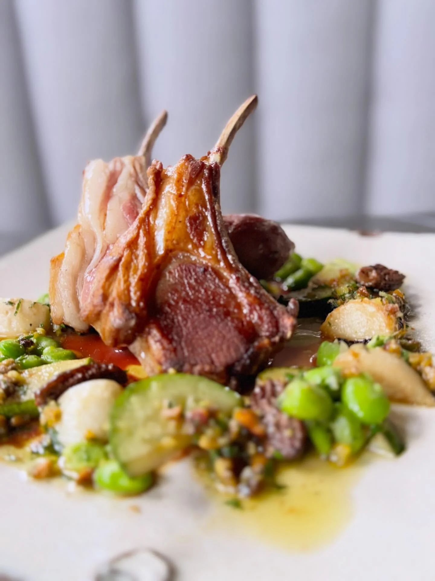Lamb rack + house-made merguez, set against the earthiness of @snowsbendfarm turnips, fava beans, kale, and morels&mdash;finished with a bright pistachio pesto to bring it all together.

A balance of fire, spice, and spring.

#HotAndHotFishClub  #Sea