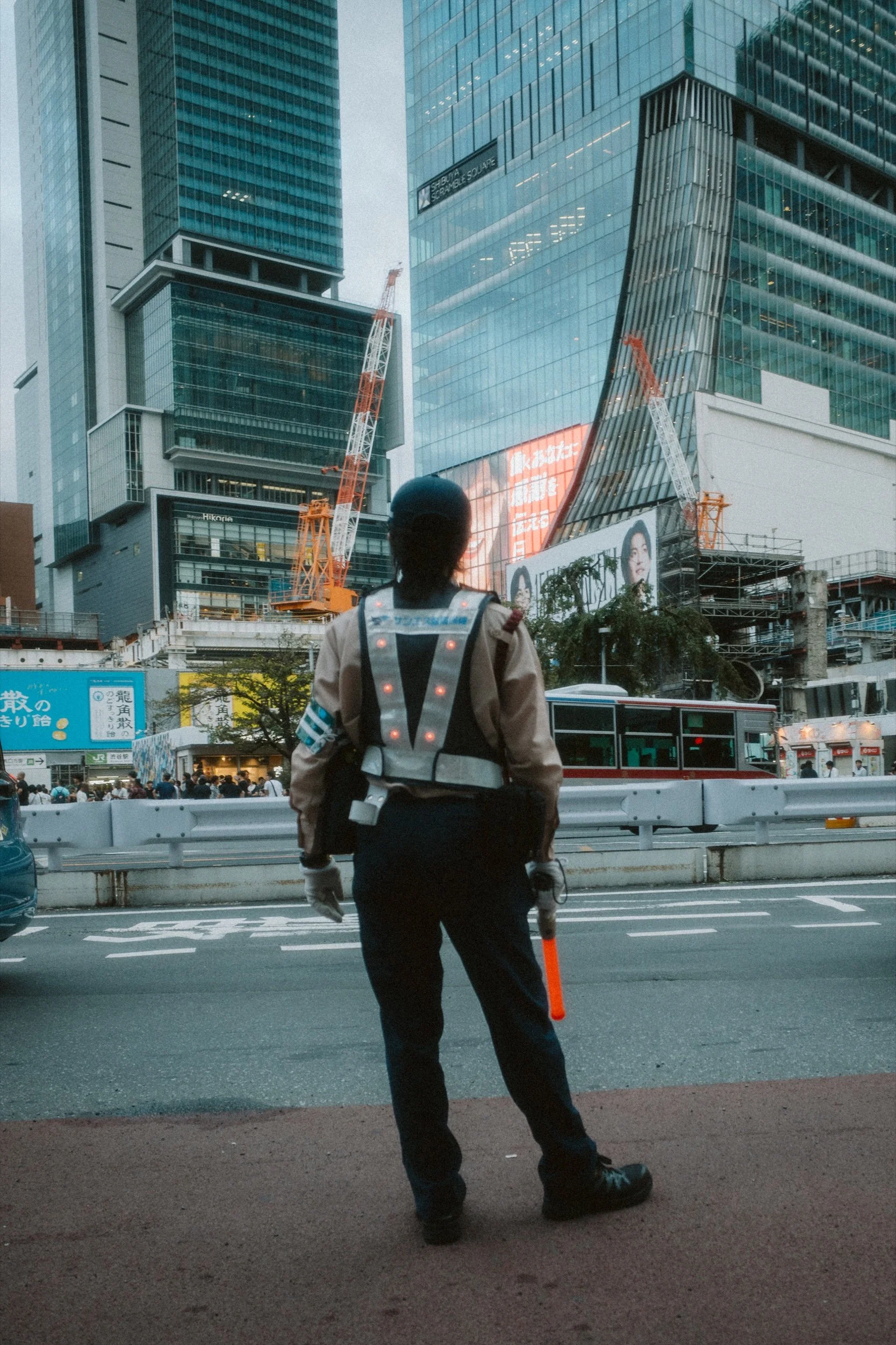 Tokyo — a figure facing the city