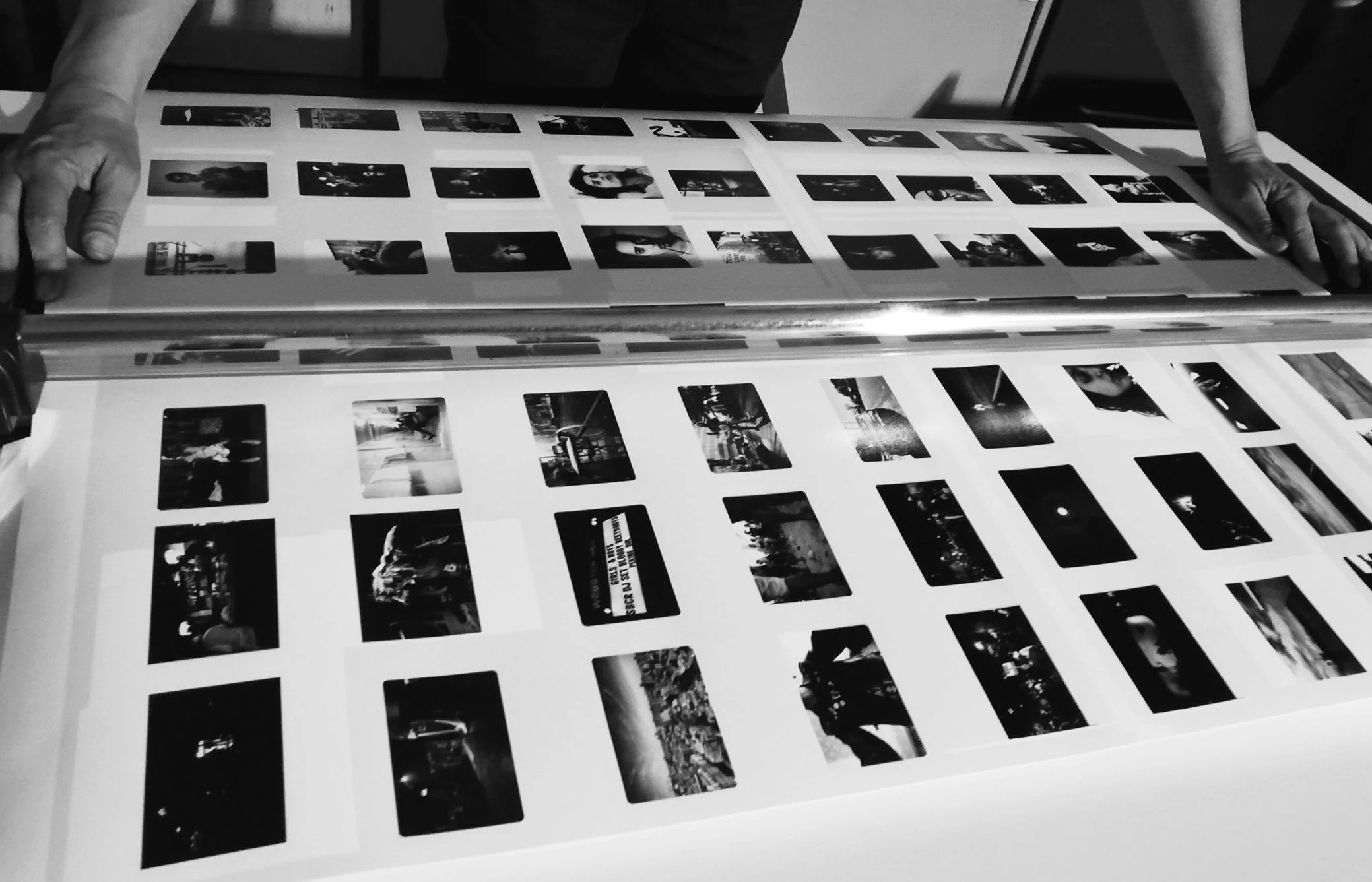 Uncut photographic proof sheets on the printer during preparation