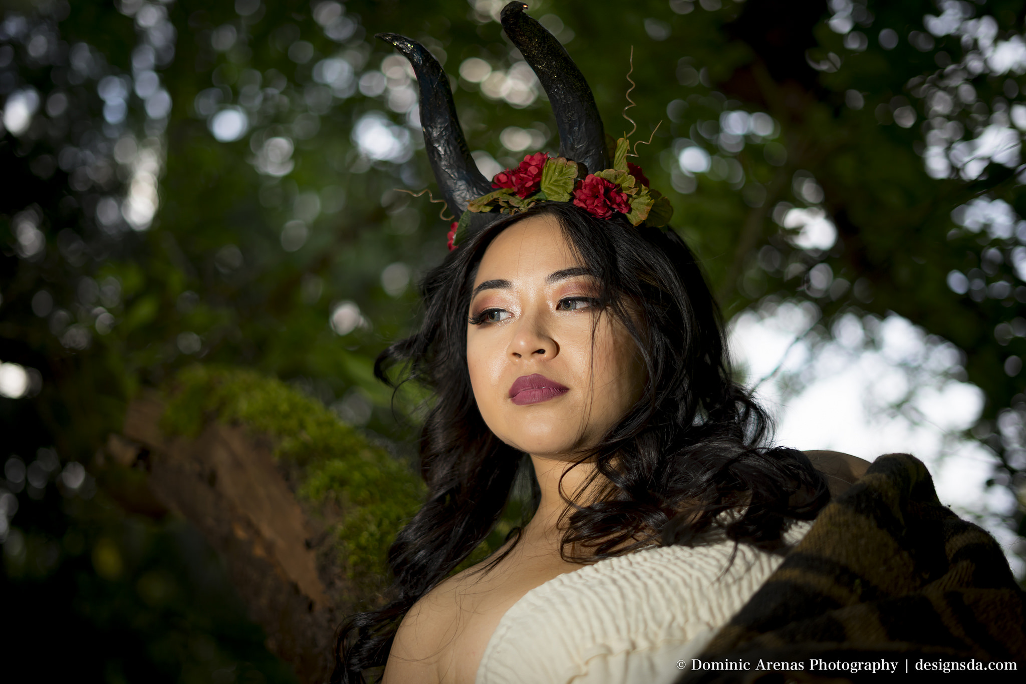 A horned beast surveys the scene from the trees. 