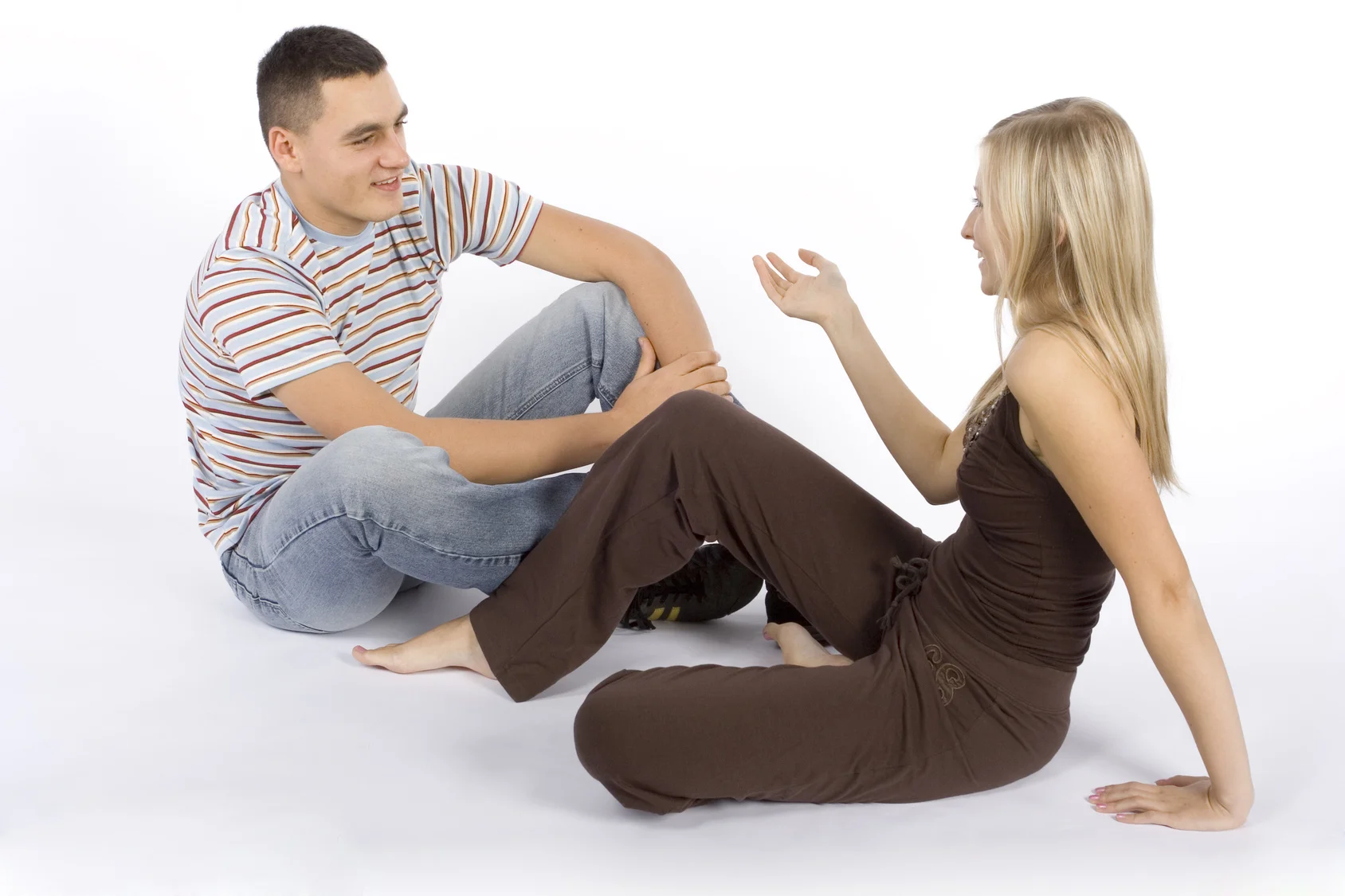 Young couple sitting and talking.