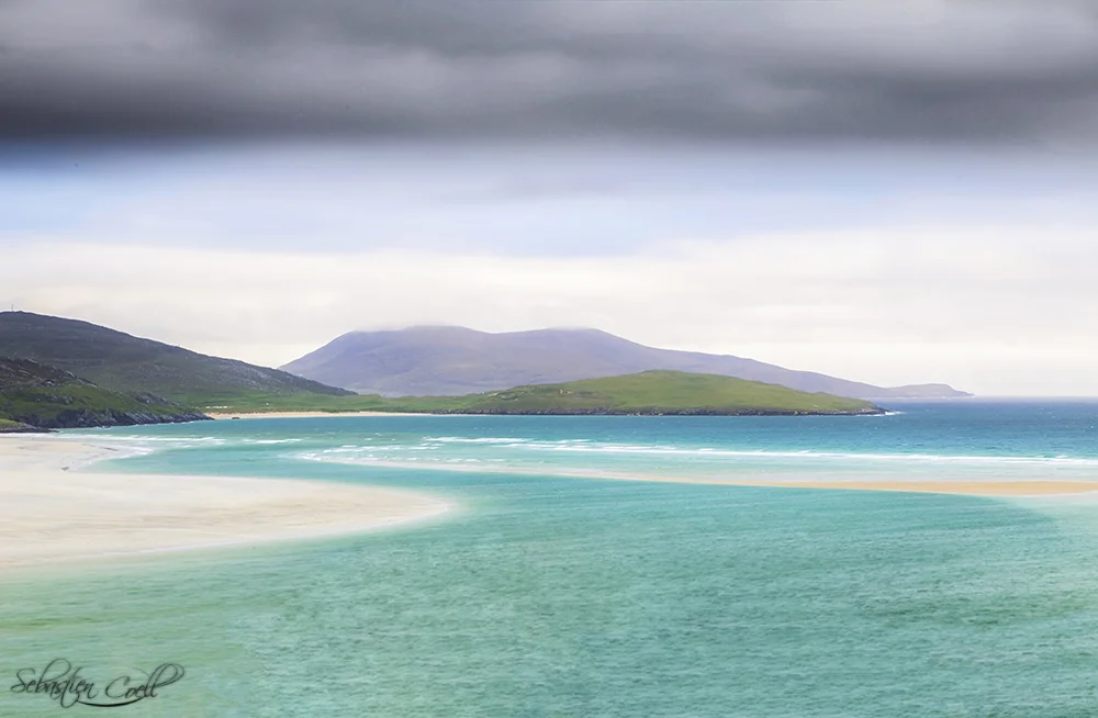 The soft teal river winds its way out to Luskentyre beach on the Isle of Harris