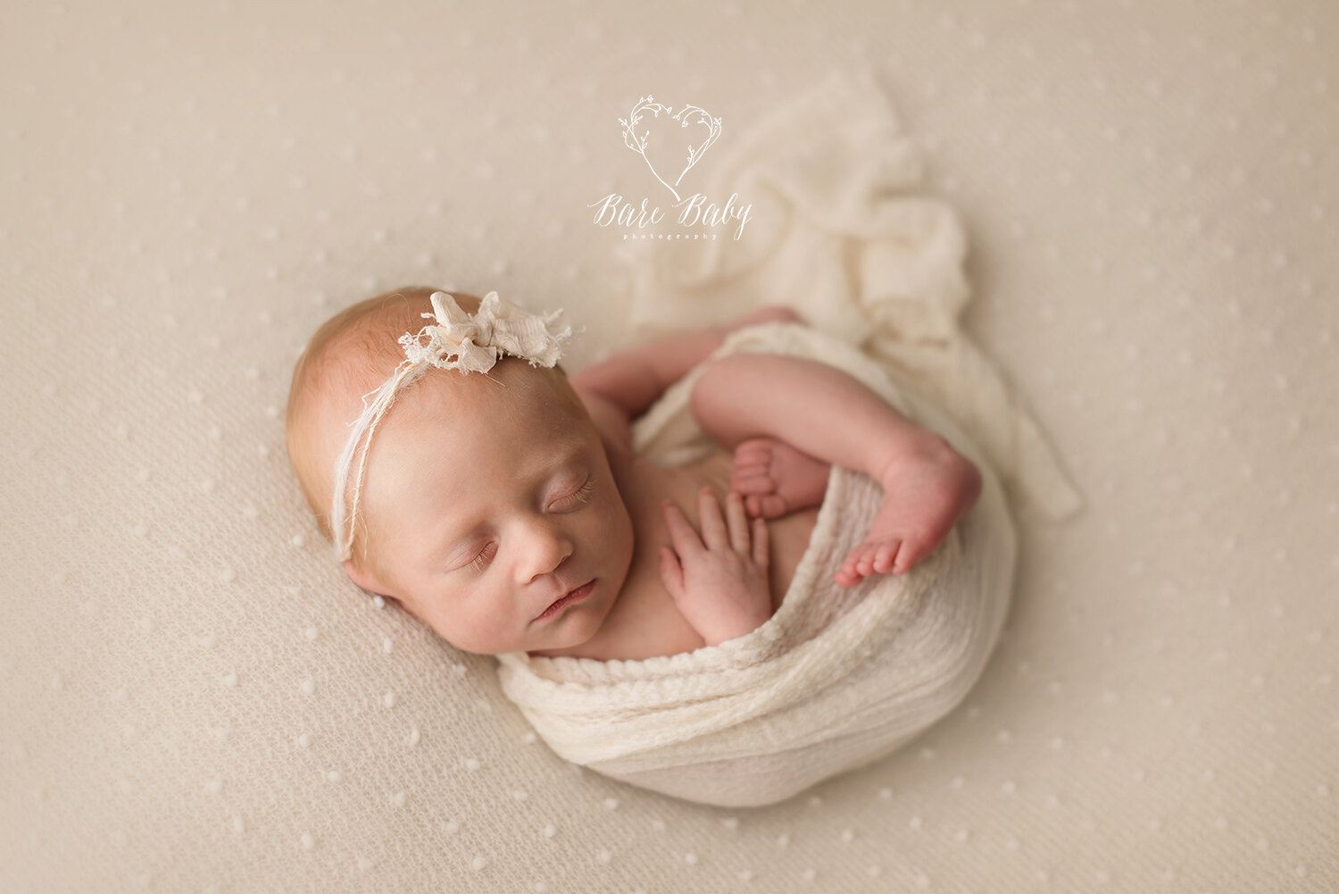 newborn-girl-creme-bow-headband-bare-baby.jpg