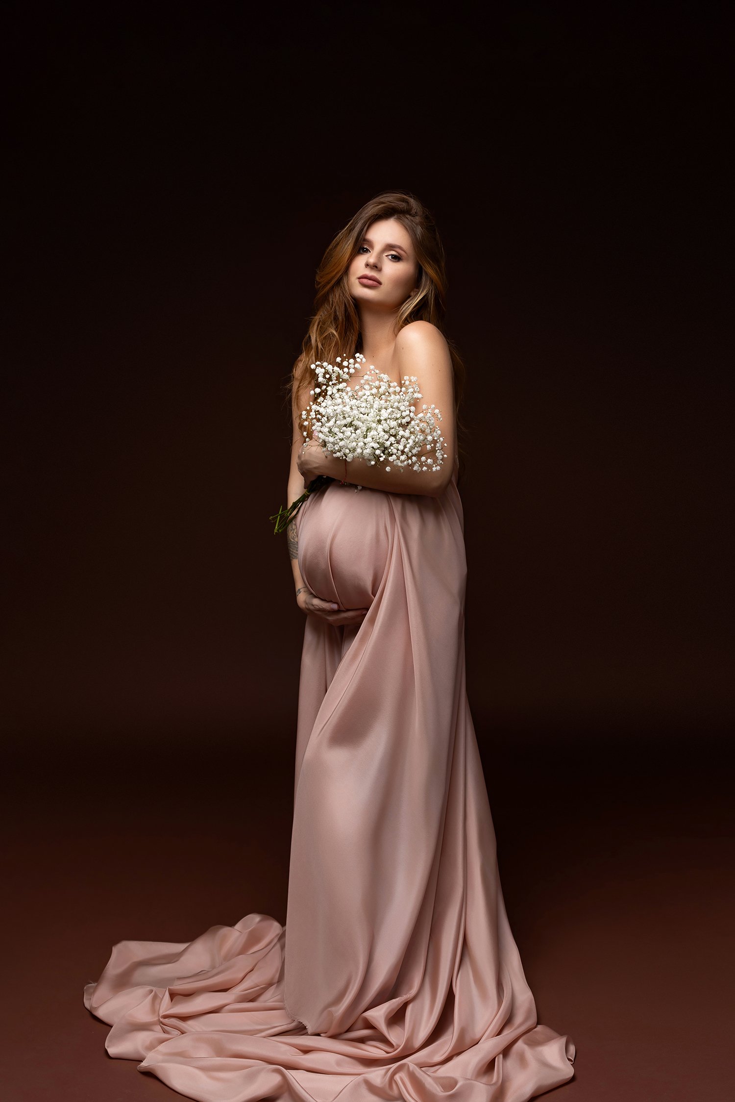long-hair-pregnant-woman-maternity-photo-columbus-ohio-flowers-pink-silk-fabric-barebaby.jpg