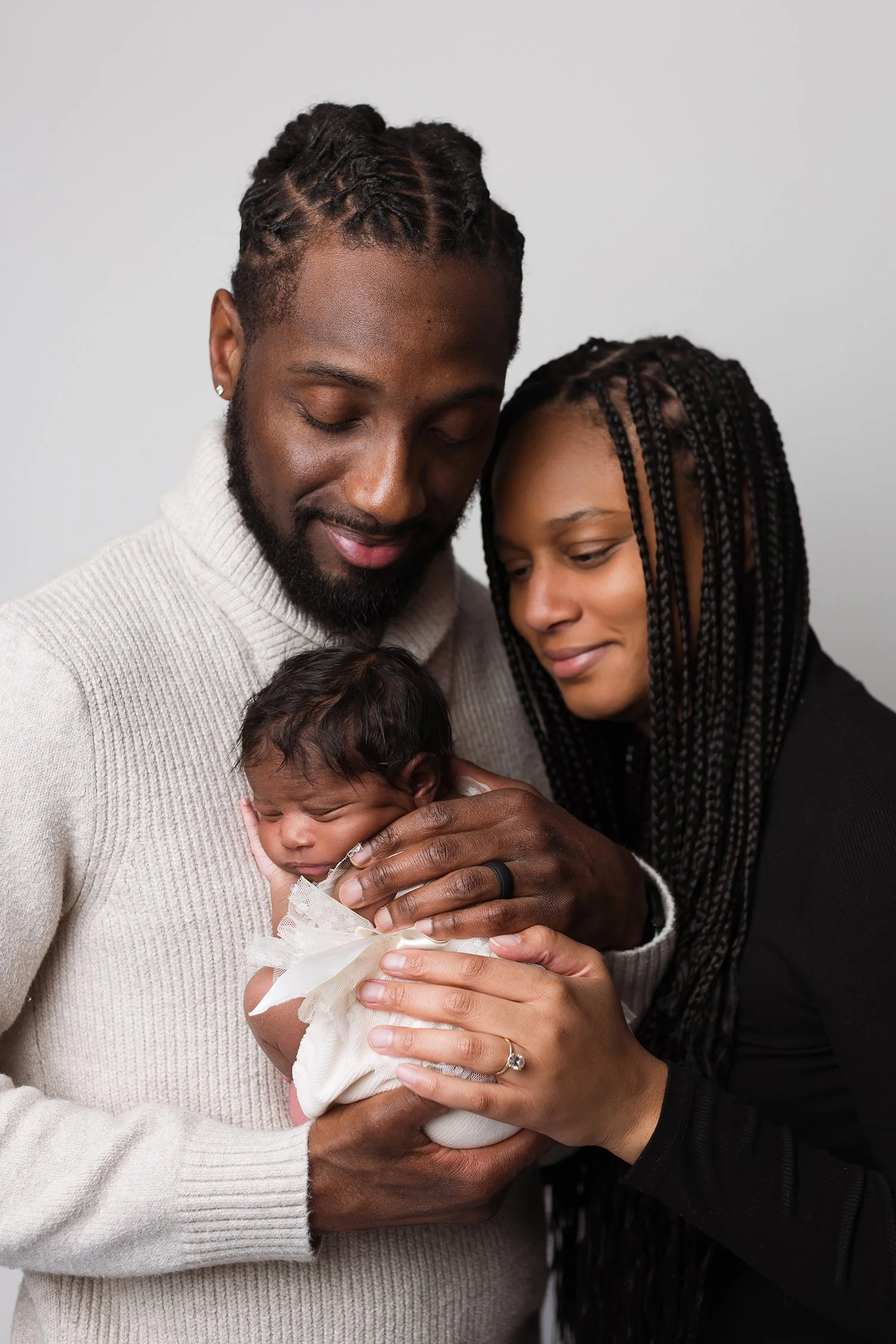 Parents holding their newborn baby during a Columbus Ohio newborn photography session