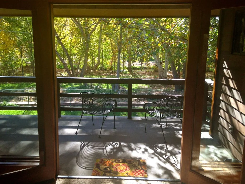 …. Master Bedroom Balcony overlooking the creek… Upstairs, Tree Top Suite-Master Bedroom with King Bed Lots of privacy upstairs, with balcony overlooking the creek. Large shared bathroom, split plan: toilet, tub & shower. $1700 for one person or $1000 each for 2 people (all inclusive except travel costs) - SOLD OUT!