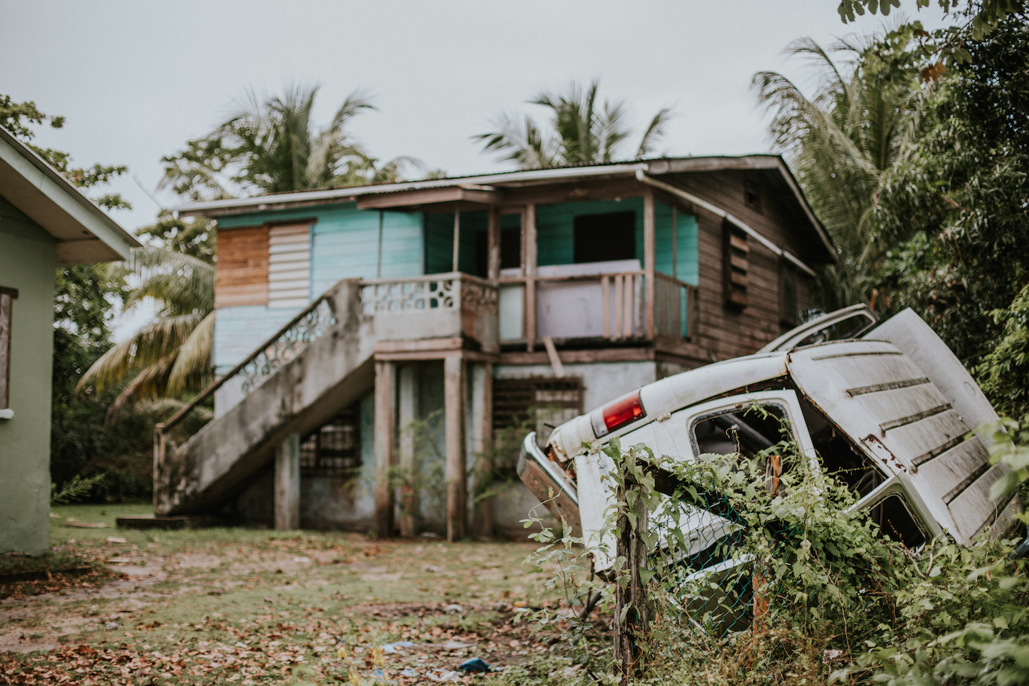 Once the pastor's house, this property has long since been abandoned. No one knows where the car came from or how it got so damaged. 