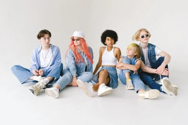 https://www.pexels.com/photo/thoughtful-multiethnic-models-in-stylish-apparel-in-studio-5325586/