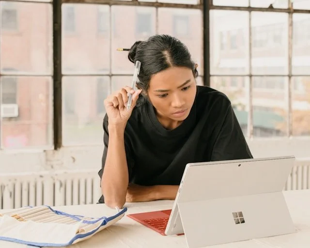 https://unsplash.com/photos/a-woman-sitting-at-a-table-using-a-laptop-computer-vwIthdobS3o  Photo by M. Cooper on Unsplash