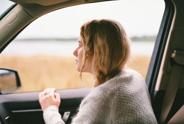 https://www.pexels.com/photo/woman-in-sweater-inside-a-car-4091194/