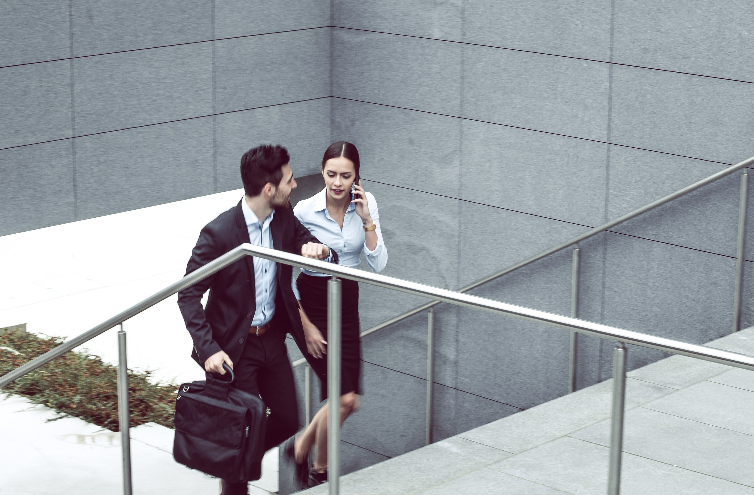 Business-Couple-Walking-up-the-Stairs-594075570_4781x3141.jpeg