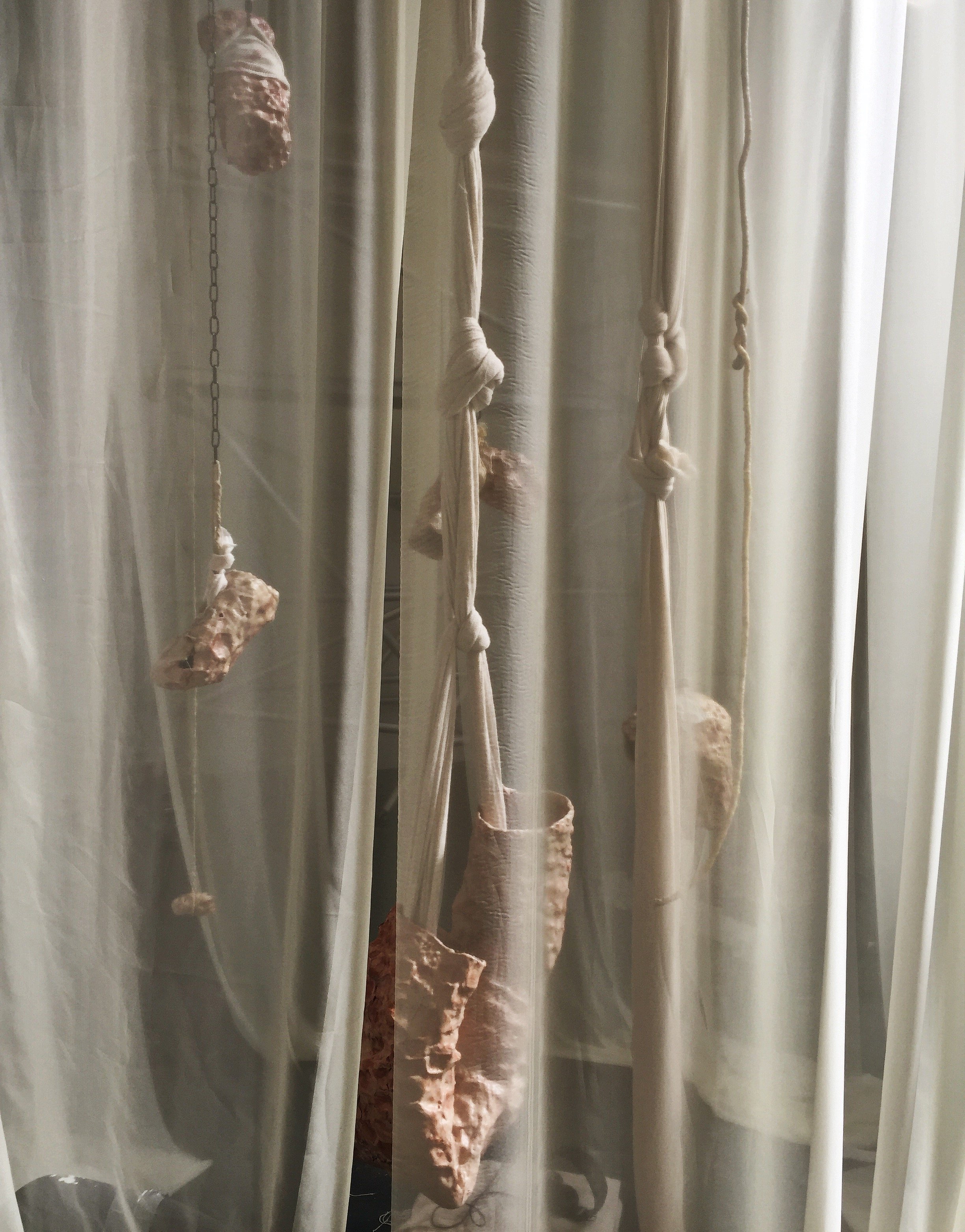   Escamas de Piel Mudada,  2018, Installation, air dry clay, wax, fabric, rope, chains. 