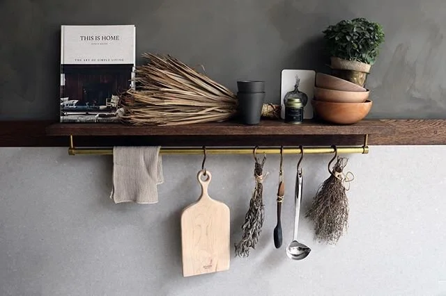 The small oak display shelf next to the sink. The perfect size that limits over crowding, but big enough to display special items on.