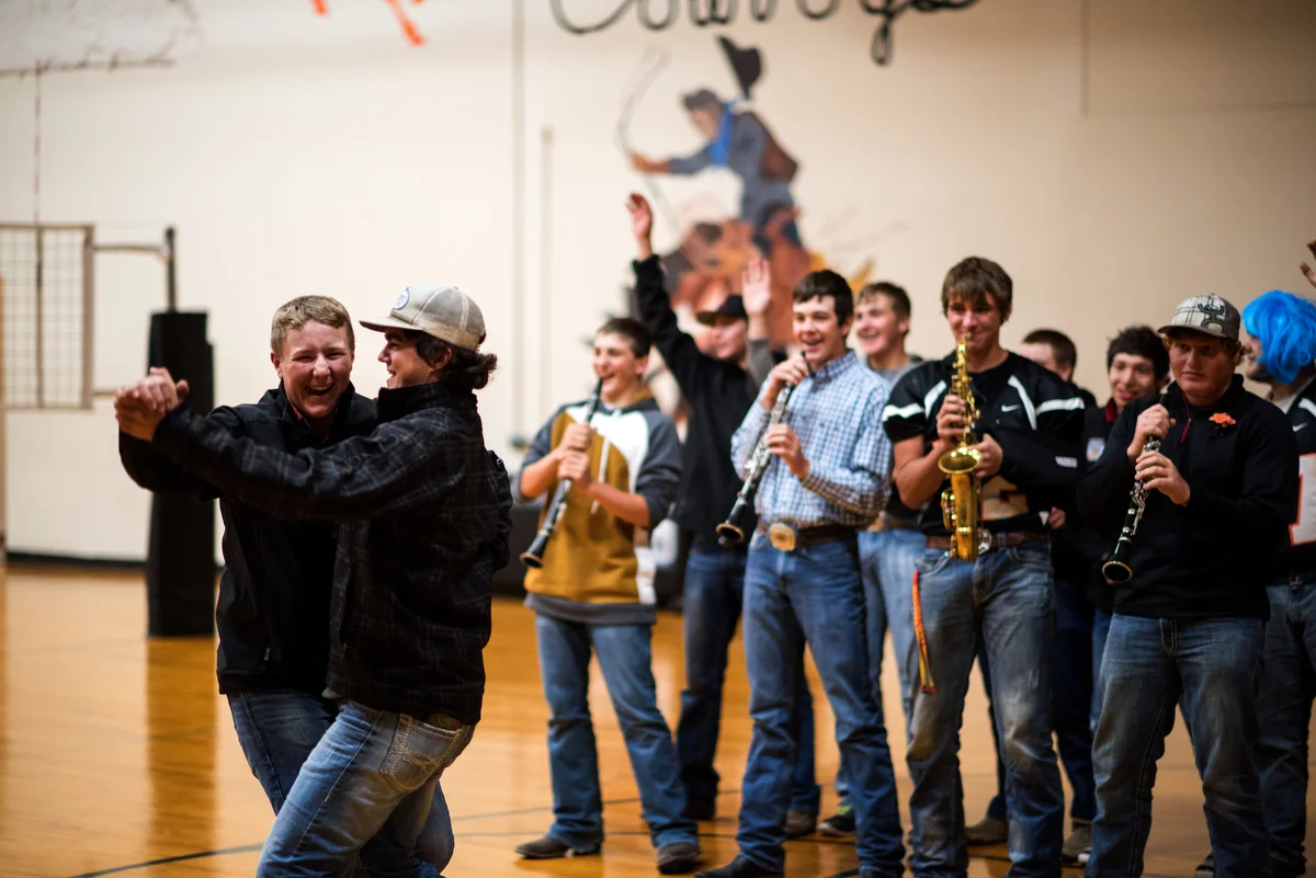 During the pep rally, football players are divided into groups, and each group draws the name of a song from a hat and puts on a skit to the song. Here, players perform "My Heart Will Go On" by Celine Dion.
