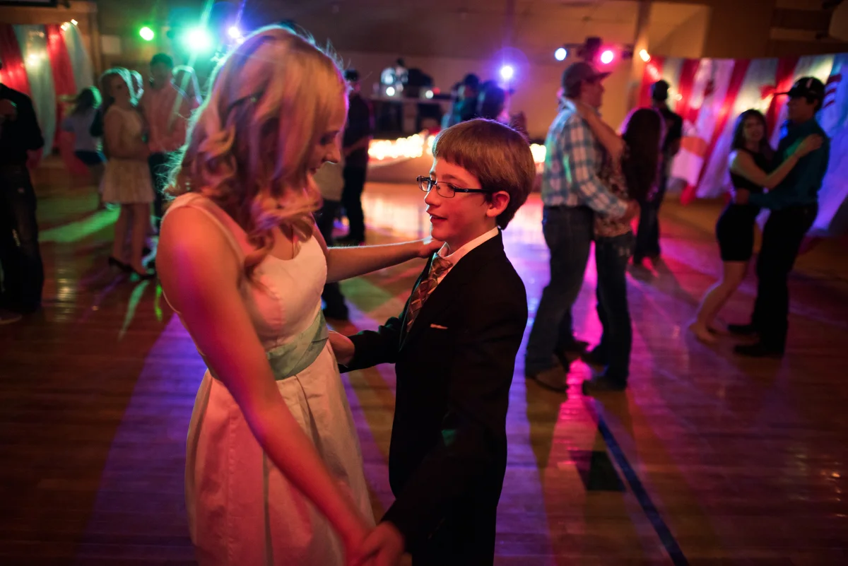 Cody residents transformed the town's civic center -- itself housed in a transformed shed -- for the school's homecoming dance. Here, senior True Ford dances with freshman Isaac Cook, the youngest kid at the dance.