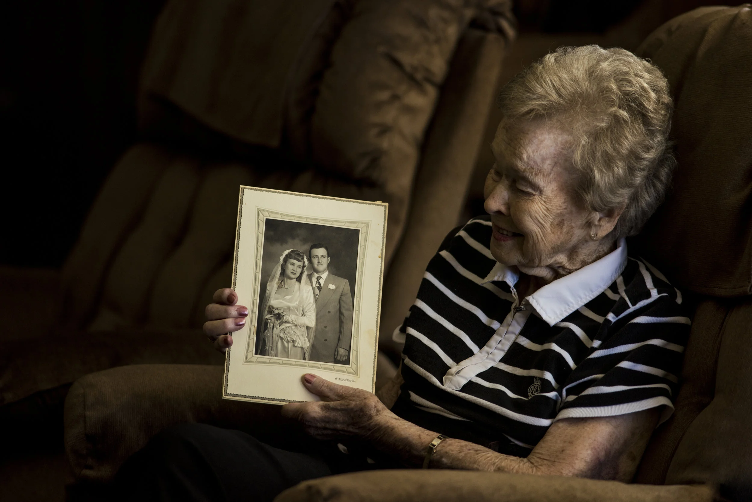  Lucille Kester looks at a picture of she and her late husband, Harold. Lucille and Harold were married on June 18, 1949, and raised 11 children together. Harold and Lucille lost their youngest, Joe, to cancer when he was 9 years old.&nbsp;  They wat