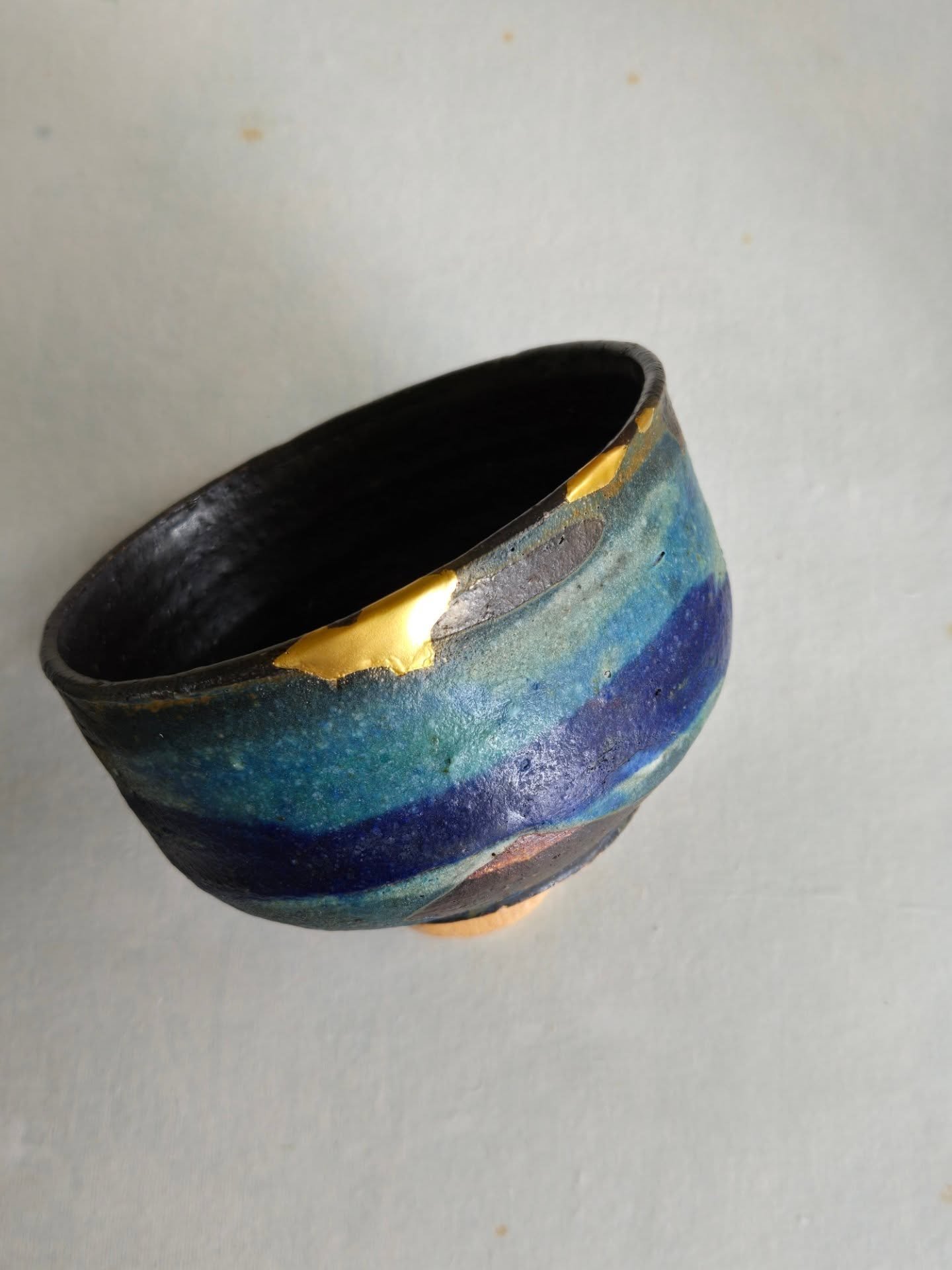 I was feeling the artist who made the bowl, what they were thinking, what philosophy they believe in, what lifestyle they lived... it's all a guess but my hands can't help but paint a picture in my heart. 

#potteryrepair #chawan #handwork