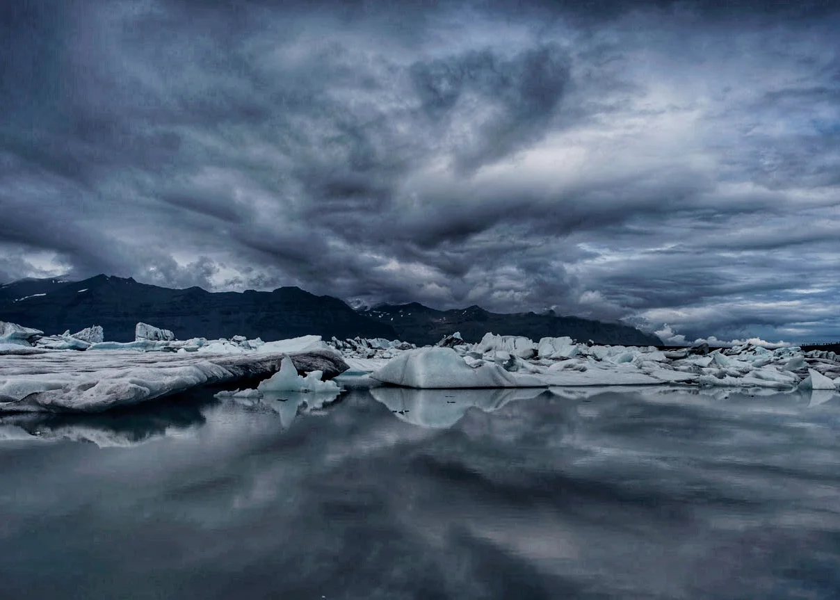 A glacier lagoon on the northeast coast of Iceland where sea and sky seemlessly blend. 