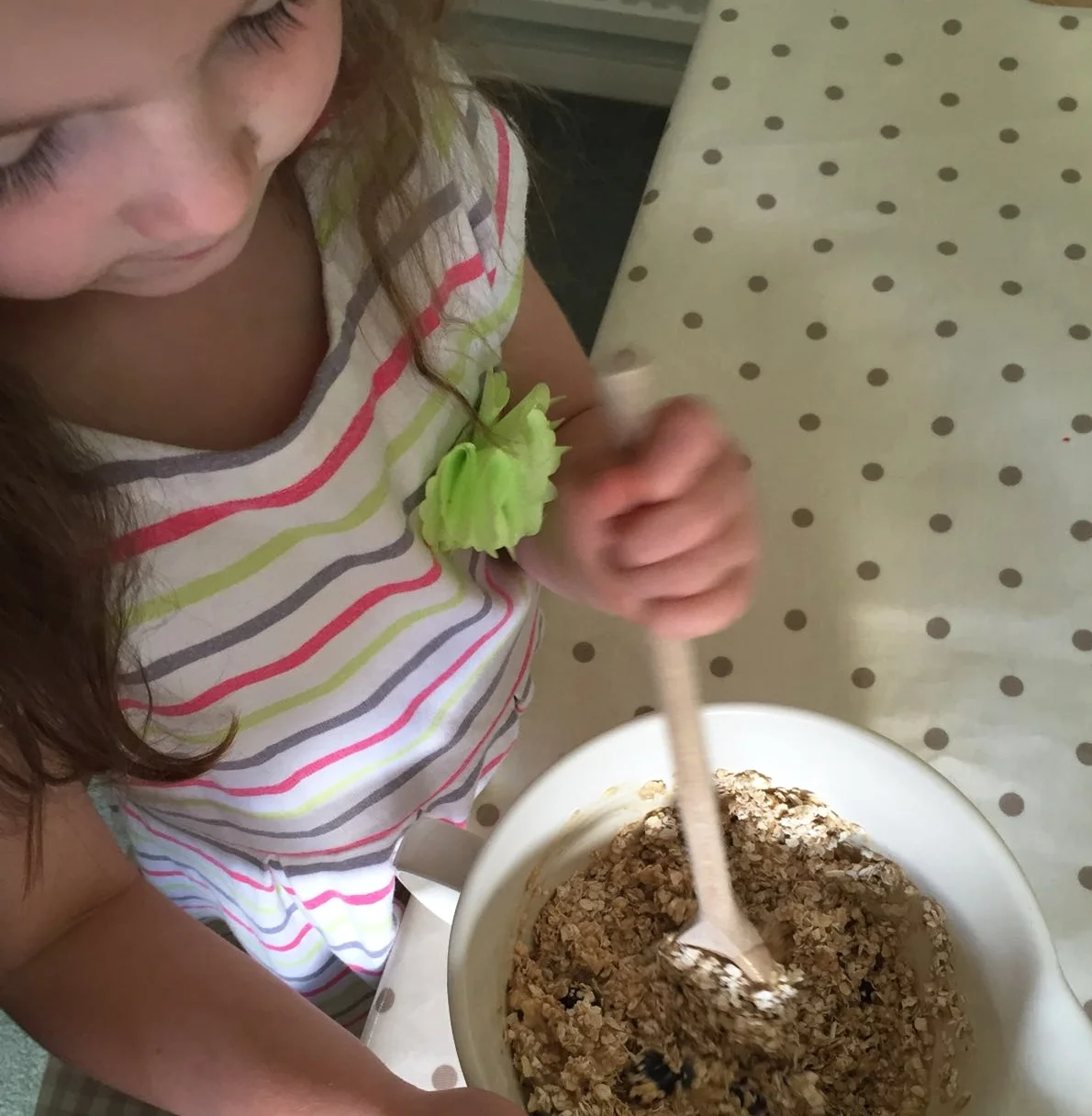 Mixing in the the oats and blueberries
