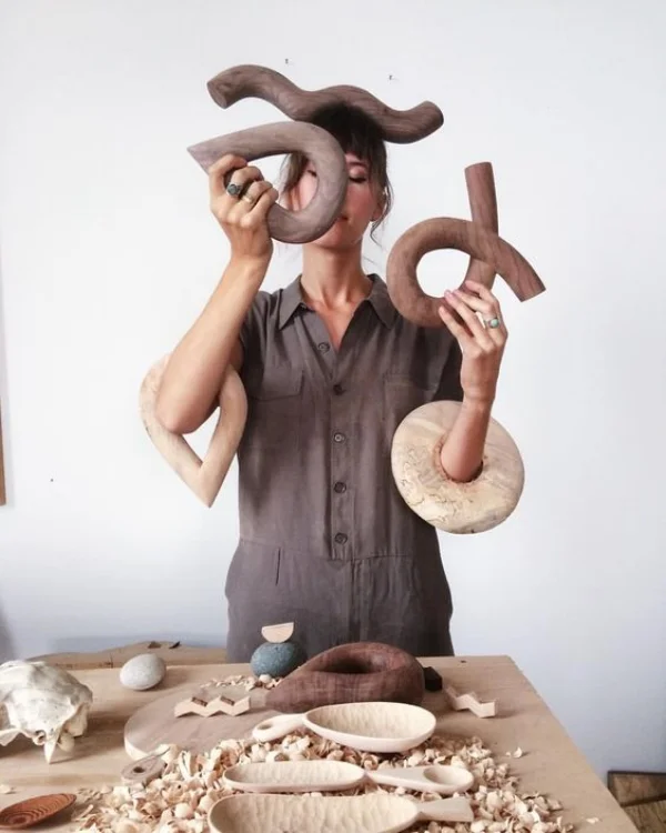 Ariele Alasko is a full-time sculptor and woodworker, based in Brooklyn. She fully embraces the healing power of curved silhouettes within her statement-making objects. 