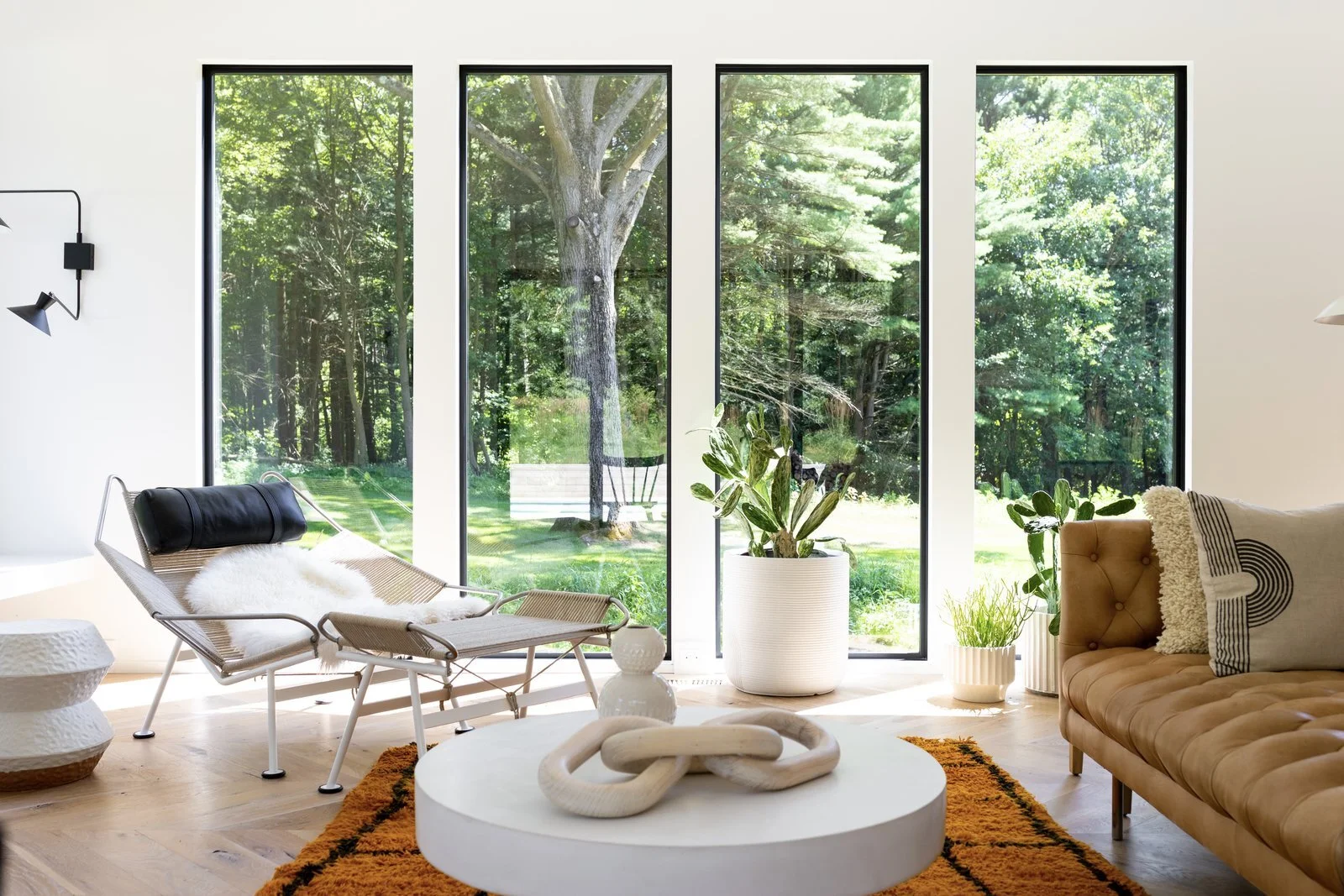 throughout-the-home-large-picture-windows-frame-views-of-the-greenery-outside-including-glimpses-of-a-150-year-old-oak-tree-the-couple-worked-hard-to-save.jpg