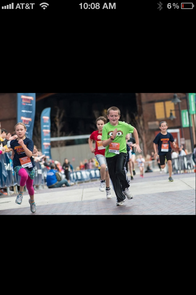 Look at these kids running … all but one shows poor form, but remember, these kids are still undergoing neurodevelopment and are learning to control their body parts. Remember, the maturation/myelination of the nervous system usually lags behind the development of the musculoskeletal system.
In the photo, lets first focus on the happy lad in the green shirt. He sure looks like he is having fun, which is what running should be about in kids. If you try to make running a chore for kids you just might lose their love of it in the process. But our point here at The Gait Guys is to teach. So here in this photo are some good teaching points. You should see:
1- the stance phase leg (right leg) is spun out into external rotation. Not too much of a big deal because we do not know if he has finished the normal derotation process of the limb, sometimes this can carry into the puberty years even though for most kids the process is largely completed by his predicted age.
2- The pelvis has drifted laterally in the frontal plane past a perpendicular line up from his foot. This could mean alot of things including gluteus medius or abdominal weakness but the point here is that he has broken through the lateral line (frontal plane) of support up through the hip-pelvis-core chain. This is going to set up what the the left knee (swing leg) is doing and will set up #3.
3. Cross over gait is virtually guaranteed because of the lateral pelvis drift as noted in #2. It is virtually guaranteed as well because the swlng leg knee coming inwards is dictating it. IF the knee is coming inwards toward the midline the thing attached to it , the foot, is going to follow. The swing leg is a pendulum, if you shift the pivot point of the pendulum (in this case to his right) the pendulum will swing to the right. This is a self-perpetuating cycle and it will not correct without strengthening, awareness and drilling positive feedback changes.
4. Dr. Allen’s current thought experiment on Ballasts (see podcast 38) is playing out here with the left arm of this fella. If the pelvis drifts far to the right, the arm will move away from the body to move some of the left side body weight outwards to negate the right shift. This is pure balance physics. Arm swing most of the time cannot be corrected without correcting the thing that causes the aberrant arm swing, and that is often (but not exclusively) aberrant lower limb and pelvis-hip-core or foot mechanics. There are exceptions, but often if you fix the lower limb and pelvis-hip mechanics you will see an immediate change in the arm swing. If you force changes in arm swing without fixing the problem (and that is not to say there are not local arm swing etiologies) you may be driving strength into a compensation pattern that you may not want or like.
5. The girl in the pink tights … . she might have been modelling the boy in the green shirt. Same issues, same concerns.
6. The form we love the most ? The boy in the dark blue shirt and black shorts on the far right. Great form, no major issues here. We bet he didn’t hear the starters gun go off.
On a side note, the fella in the green shirt with that form he would be a champion race walker. He already has the hip action right, the cross over that is loved in that sport and the arm swing. Maybe some exposure to an alternate sport is a better solution here ? Although we are always an advocate for correcting flawed biomechanics.
It is often painful for us to watch kids run. We know that much of the things we hate are temporary because of the neuro-developmental process. But sometimes, if kids run too much at a young age, and are pressed into long running miles or cross country at too young an age, these aberrant mechanics can become their new norm. This is the danger of plasticity in the nervous system. Repeated stimulation of a pattern engrains that pattern and the extent of a brain’s plasticity is dependent on the stage of neuro-development and the brain region affected. When an aberrant running form is allowed to perpetuate into the mid-teenage years, when the majority of the synapses are already formed and neurologic “pruning” and myelination are ramping up, then the repeated exposure to the aberrant pattern can get the myelination. This is the most frustrating thing for us. We would rather see some intervention early on with the creation, strengthening and myelinating of correct motor patterns through skill development training rather than mileage training, rather than discarding the more appropriate synapses that could have, might have, should have, been formed. Our bodies and brain will develop depending on the exposures and demands put upon it. And here is the big key, if you do not clean up someone’s gait aberrancy(s) early on, one should not wonder down the road why they developed flat feet, bunions, early degenerative knees and the like. This is a fairly predictable machine, but you have to try to intervene early to prevent the slings and arrows of outrageous misfortune later on.
Both the brain and the body will adapt to their environment, whether that is an optimal one or a compensatory one. It can myelinate either pathway. Which one will you choose for your kids ?
Shawn and Ivo, The Gait Guys