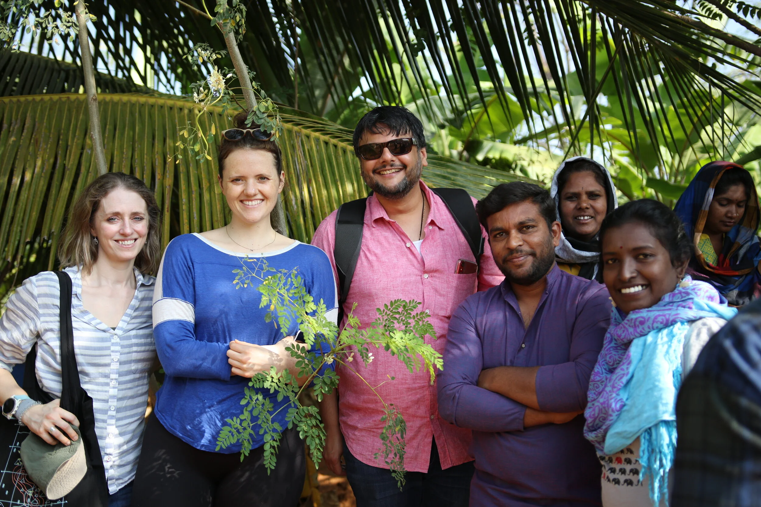  Through field visits and hands-on activities, agroecology trainers explained the principles of ZBNF. Participants learned about the five-layer model, in which the field is designed to mimic a forest. Trees, like coconut or mango, are planted alongsi