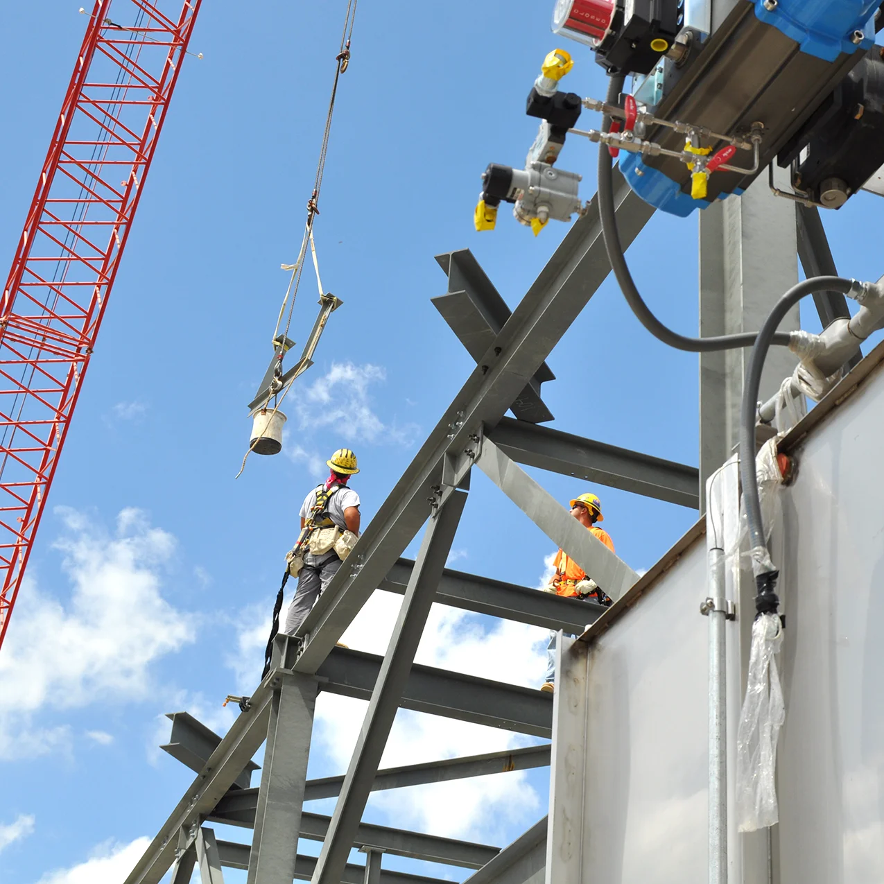 stock-photo-men-work-on-the-old-factory-for-the-installation-of-equipment-in-protective-helmets-287328185.jpg