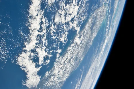 Clouds can both cool the planet (by reflecting visible light from the sun) and warm the planet (by absorbing heat radiation emitted by the surface). Credit: NASA Earth Observatory (NASA Astronaut Photograph STS31-E-9552 , courtesy Johnson Space Center Earth Observations Lab. )