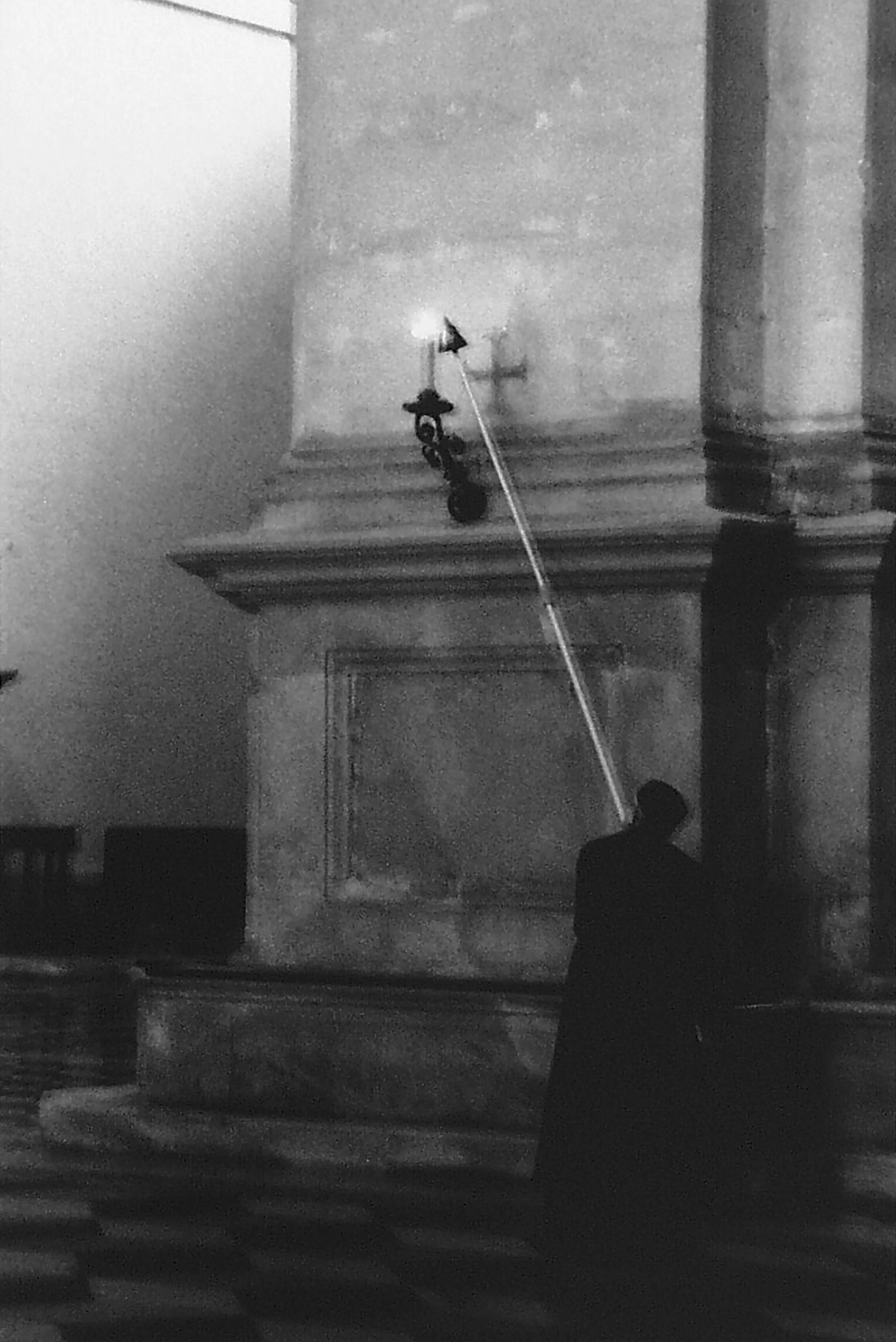 Priest Lighting Candle