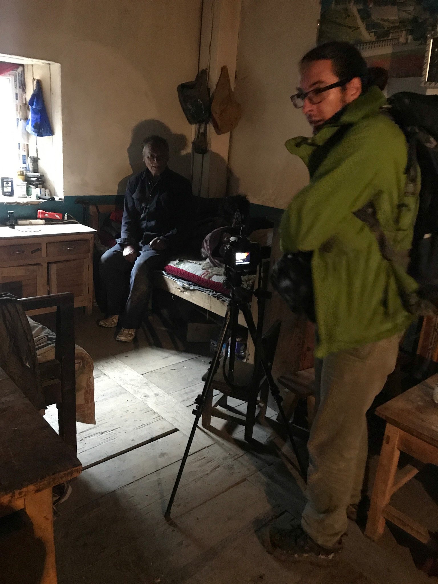 Interviewing elder Tibetan farmer