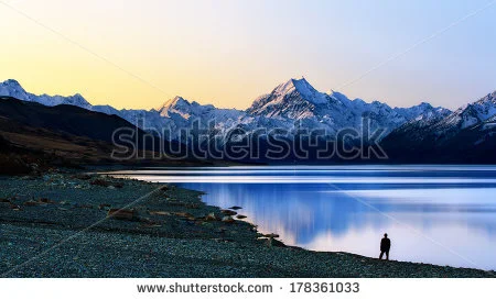 stock-photo-a-man-standing-facing-the-mountain-178361033.jpg