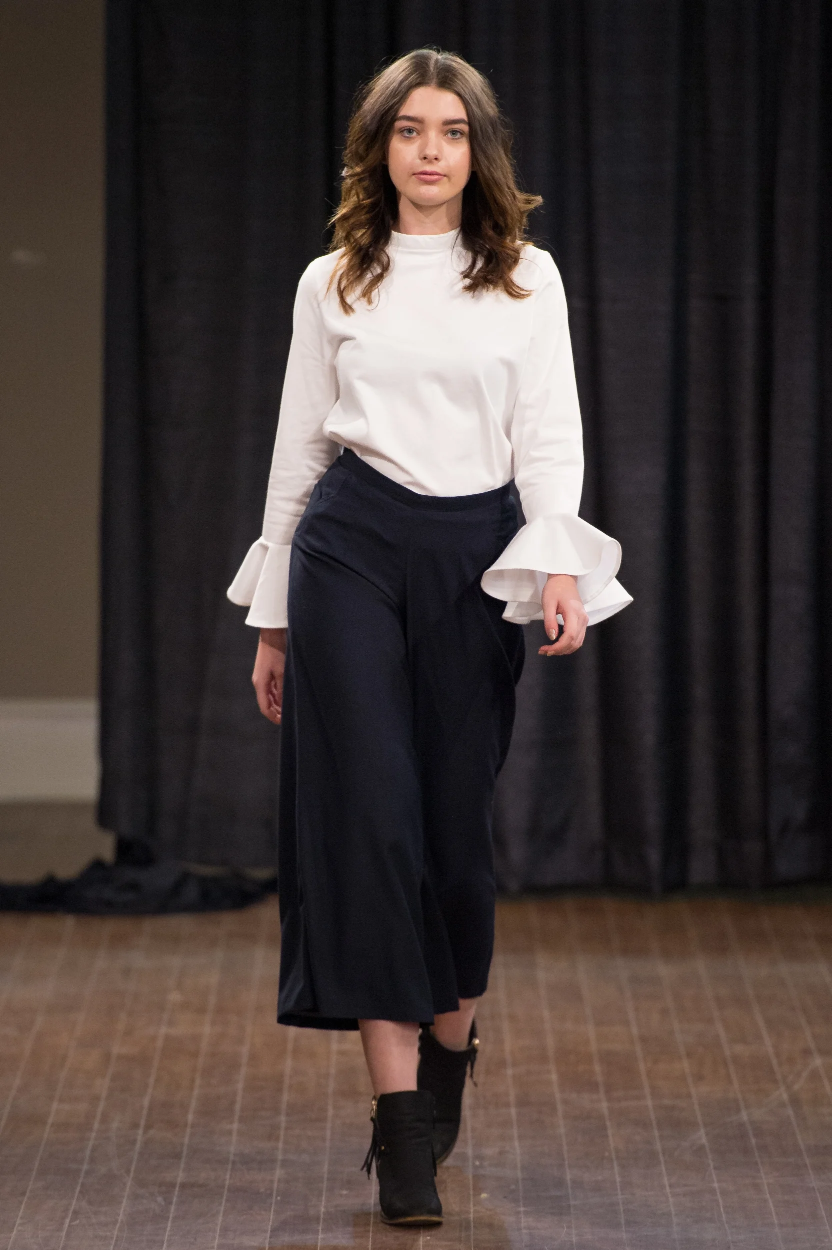 Look 01 - Flounce Top Available Sizes: XS/S M/L Available Colours: White ( 97% Cotton / 3% Spandex) Navy (100% Cotton Voile) SOLD OUT Culotte Available Sizes: 0/2 4/6 8/10 Available Colours: Gold (70% Wool / 30% Polyester) Navy (75% Polyester / 25% Rayon)