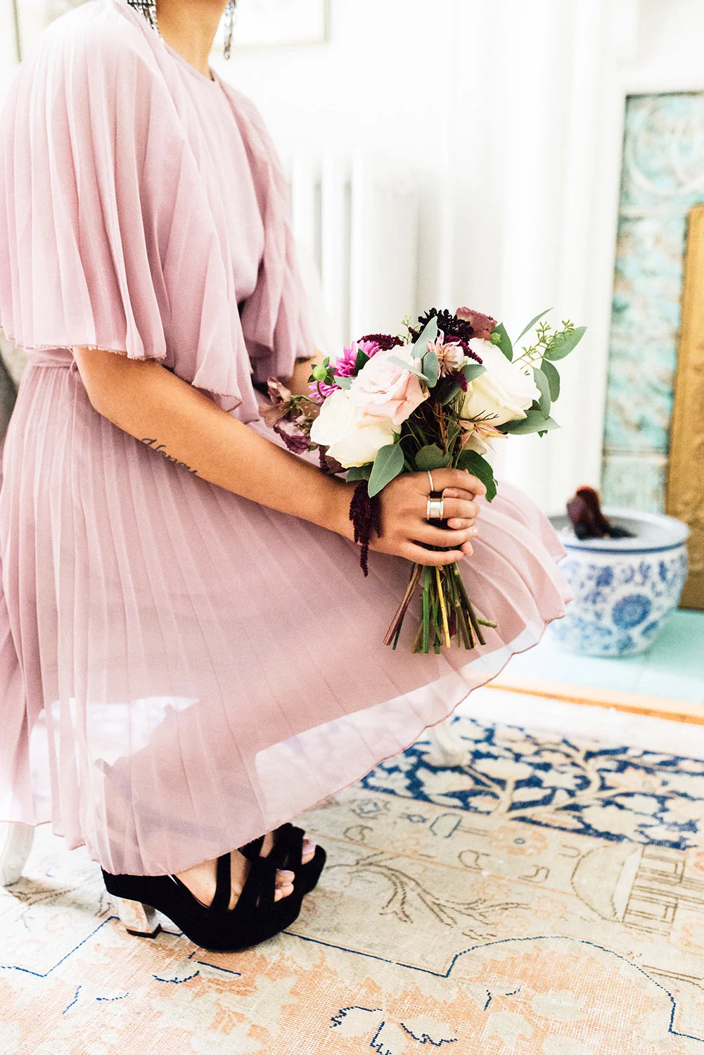 bridesmaid kneeling in front of fireplace - pink dress.jpg