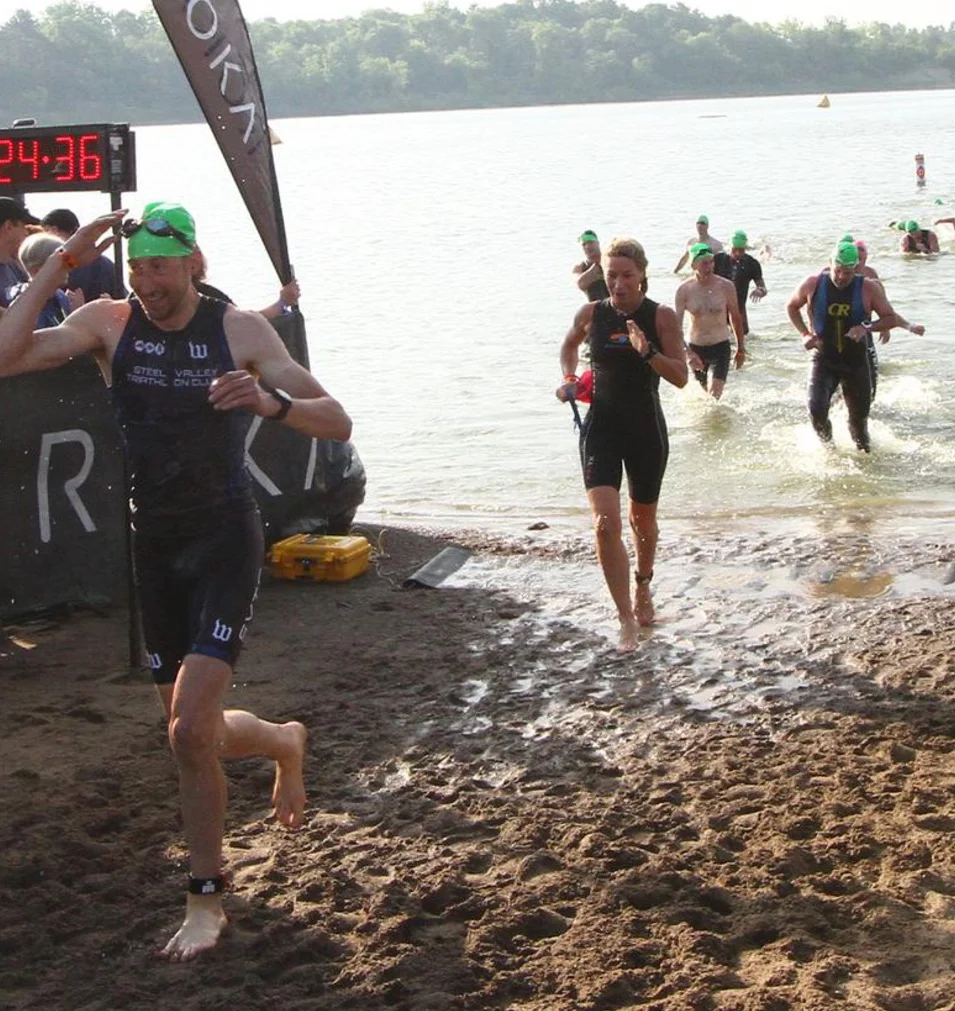 Ironman 70.3 - Ohio. Coach Amy energized and relieved coming out of the LONG swim. 