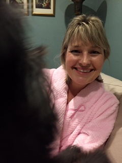Comfy in my fluffy pink robe, photo bombed by my fluffy black dog Daisy.