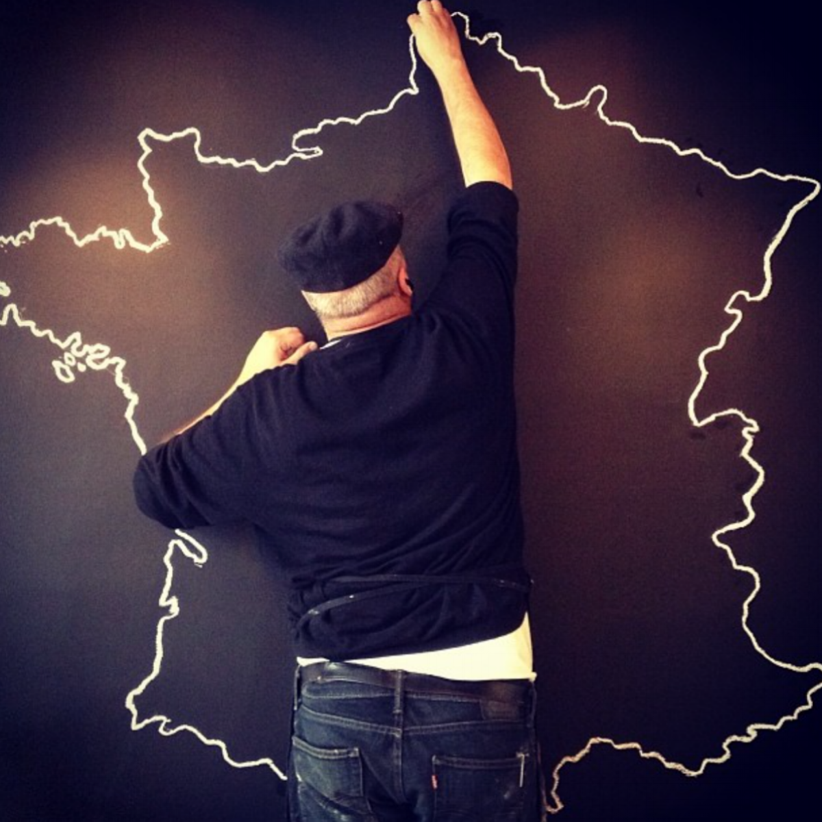 man outlining map