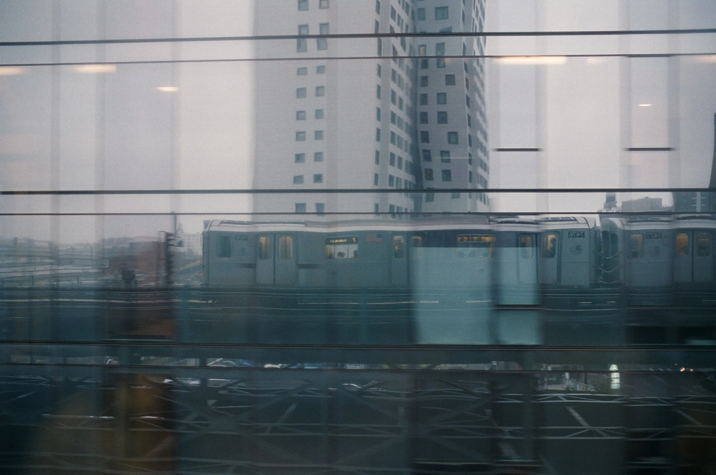  Views from the 7  Always such great reflections on this building, and many attempts at a shot like this. Finally, a good one!  I’m the blob in the door window just to the right of the flag. 