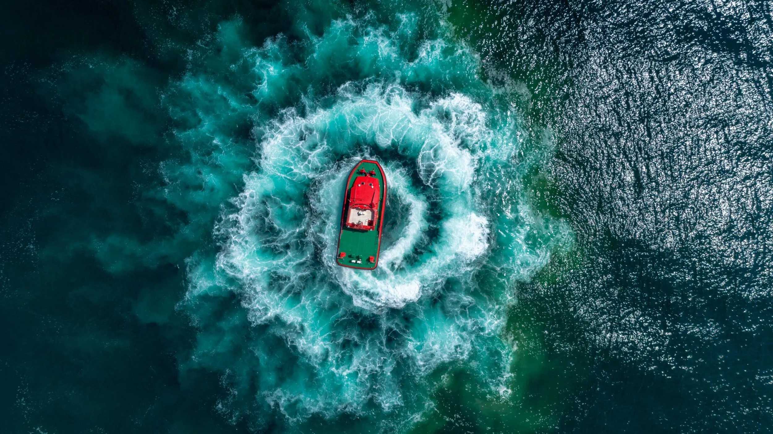 top-view-photo-of-boat-on-ocean-1555313-scaled.jpeg