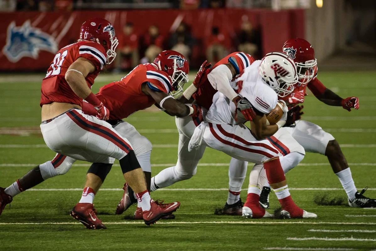 The Stony Brook Defensive wraps up Sacred Heart University running back Khalil Walker-Eldridge on September 24, 2016.