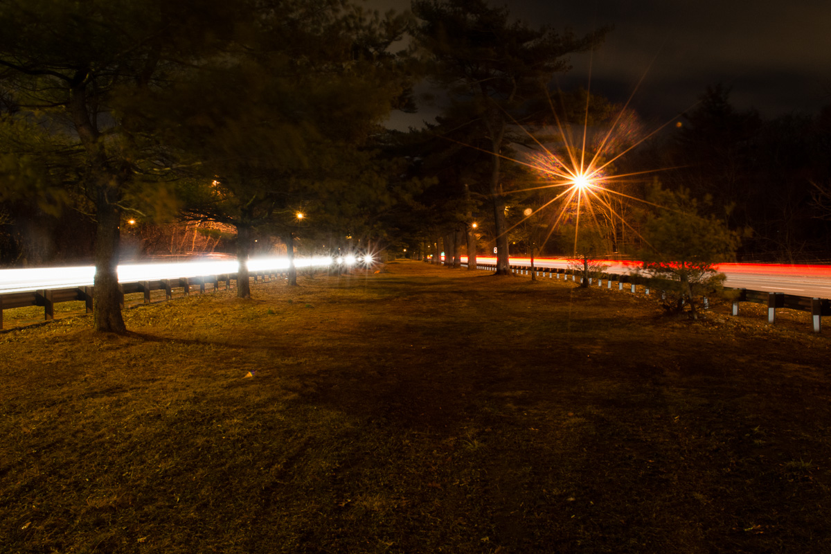 Once home to one of the most notable family in Long Island history, the Belmont Estate now exists as much of modern day North Babylon and as the Belmont Lake State Park. This was once the road to the Estate's Mansion. Now the roadway sits barren of the carriages and vehicles which once came and went from the estate. The roadway sits tucked between the eastbound and westbound Southern State Parkway which sees thousands of cars pass by this unsuspecting strip of ancient roadway everyday.