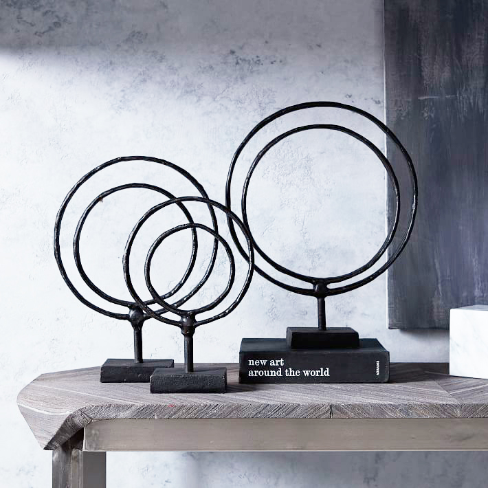 Ring Sculptures . I love the inconsistencies and handmade-like quality of these metal accessories. Use them in a grouping for major impact or select a single size to incorporate into your bookshelves to add visual height and interest. $39 and up.