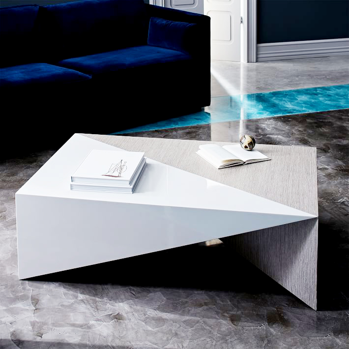 Faceted Lacquer Coffee Table . Ok, how amazing is this piece? A combination of sleek white lacquer and heavily-grained wood, this is the ultimate textural and sculptural centerpiece for a living room. $599.