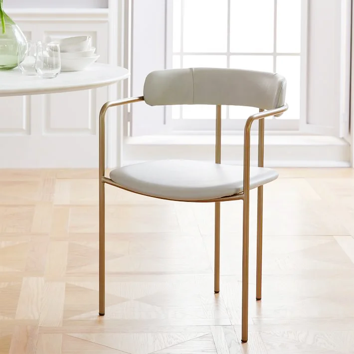 Lenox Leather Dining Chair . Delicate and feminine, I would pair these sleek dining chairs with a heftier wood table to add contrast and interest to even the smallest of dining spaces. $349.