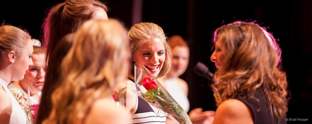 faculty-receiving-roses-after-performance.jpg